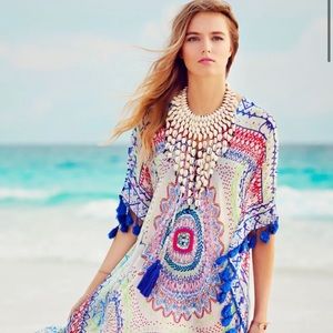 Beautiful unique cowrie shells and wood braided necklace with adjustable straps.